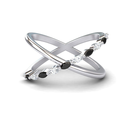The Black & White Diamond Crossover Ring - Gracie features two intersecting silver bands, one plain and one set with alternating black and white diamonds, elegantly displayed on a white background.