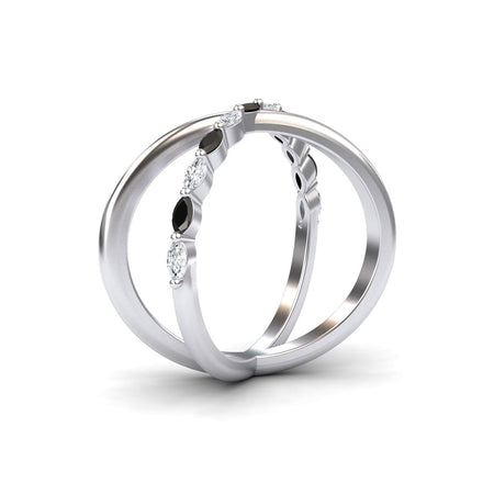 Two silver bands intertwine in the Gracie Black & White Diamond Crossover Ring, with one band featuring alternating marquise-shaped black diamonds and round white diamonds, shown against a white background.