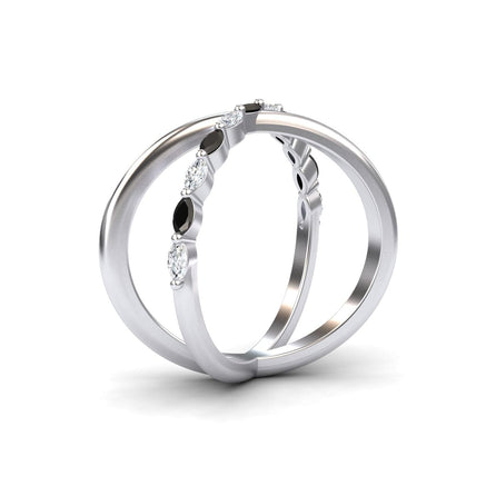 Two silver bands intertwine in the Gracie Black & White Diamond Crossover Ring, with one band featuring alternating marquise-shaped black diamonds and round white diamonds, shown against a white background.