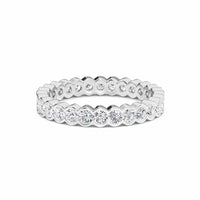 white gold ring with diamond accents on a white background