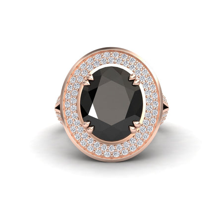 The Black & White Diamond Halo Statement Ring - Roma features an oval black gemstone set in a rose gold band, encircled by a double halo of white diamonds, displayed on a plain white background.