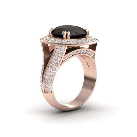 The Black & White Diamond Halo Statement Ring - Roma is shown from an angled side view, featuring a large round black gemstone at the center with a halo and band adorned with sparkling white diamonds in rose gold.