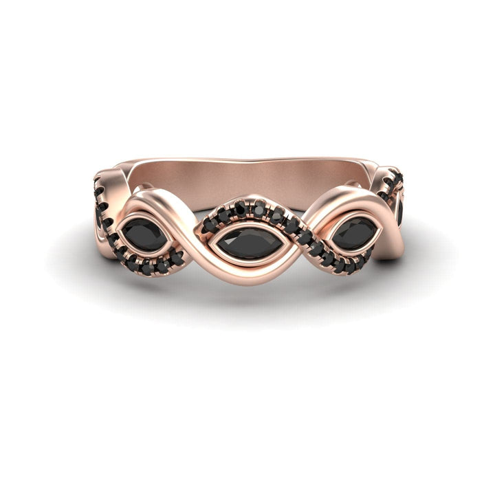The Black Diamond Infinity Twist Band - Selma is a rose gold ring with a twisted band, featuring marquise-shaped black stones and small black stones set along its curves.