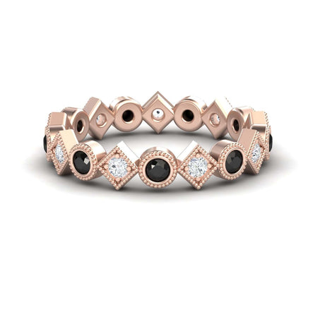 The Black & White Diamond Geometric Eternity Band - Hetal is a rose gold ring with alternating black and white diamonds set in geometric square and circular bezels, arranged in a repeating pattern around the band.