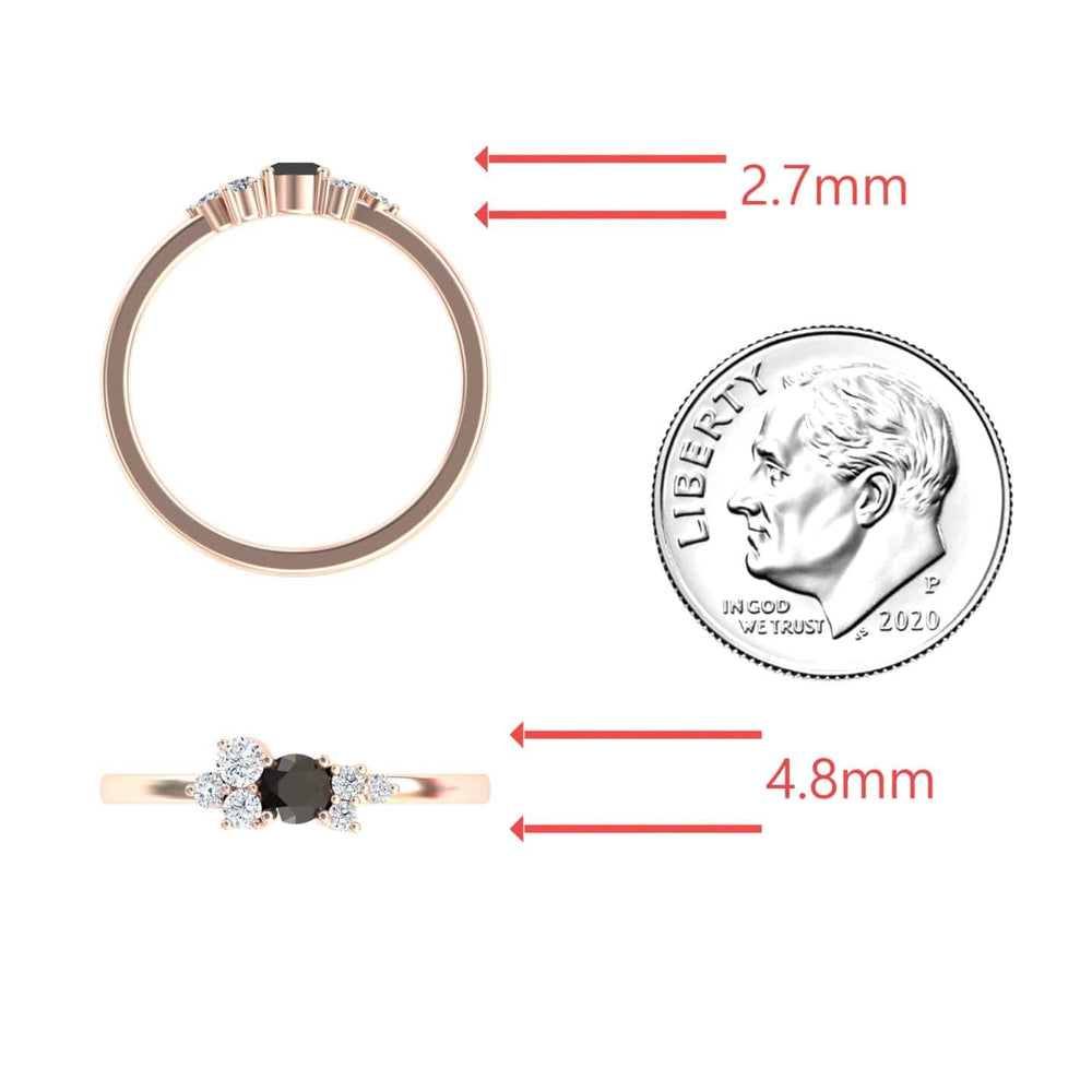 The Black & White Diamond Cluster Ring - Liana, featuring a center black stone and side diamonds, is shown next to a U.S. dime; red arrows mark its 2.7mm top width and 4.8mm front stone span.