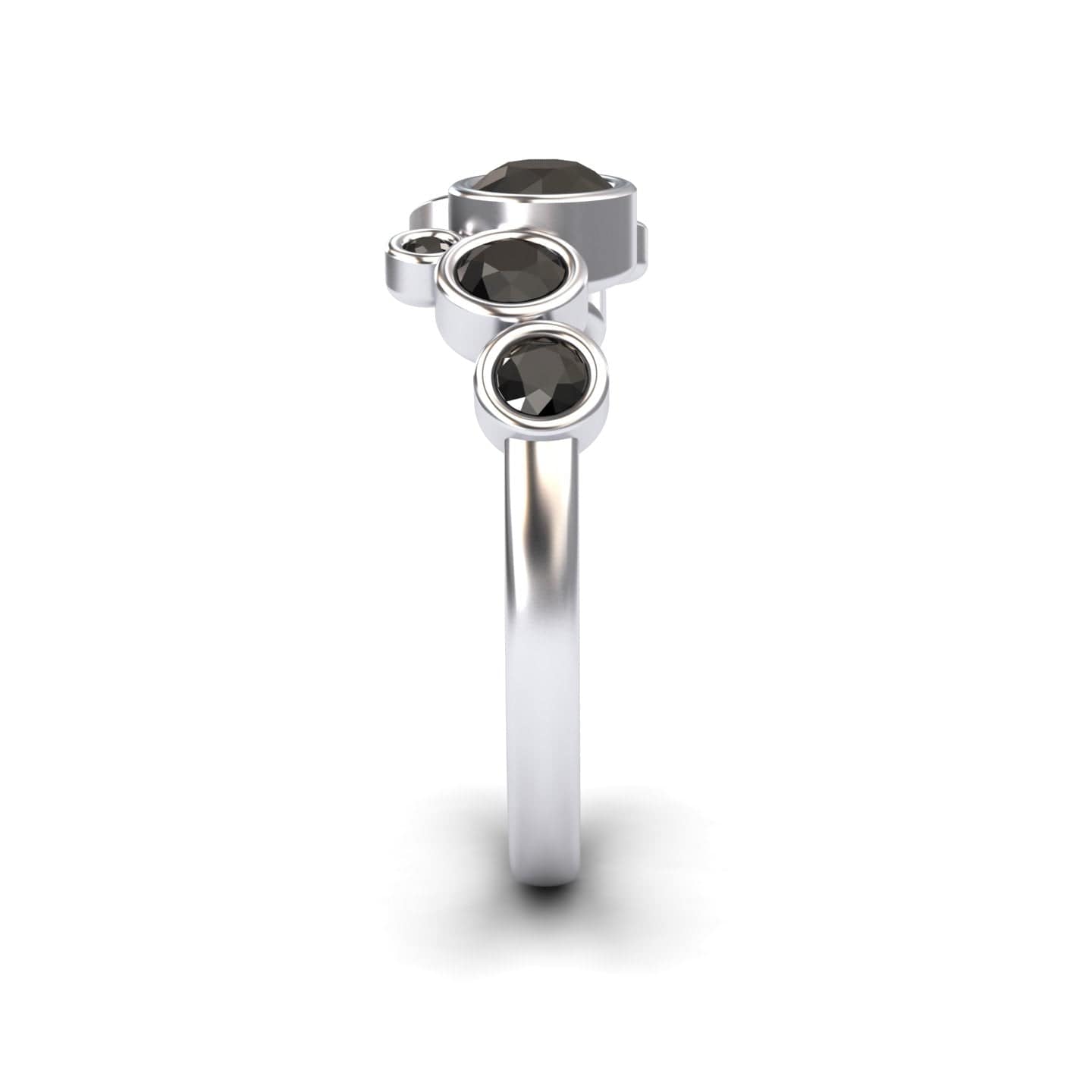 The Black Diamond Bubble Ring - Carmen is a silver ring with four round black diamonds of varying sizes set vertically in an asymmetrical design on a simple band, displayed front-facing against a white background.