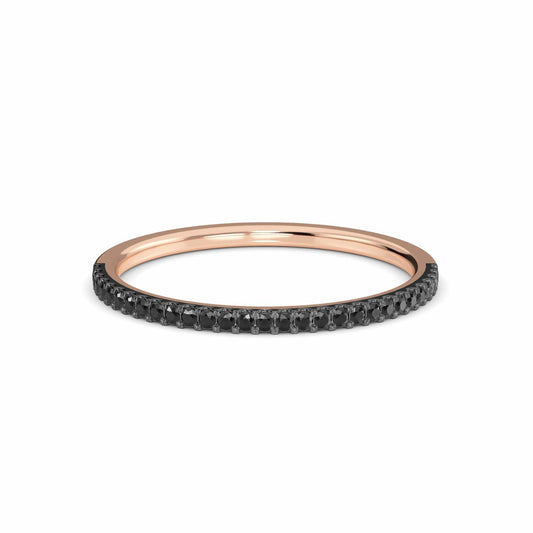 The Stephanie Black Diamond Pave Half Eternity Band Ring features a thin rose gold band with a row of small black diamonds, shown against a white background.