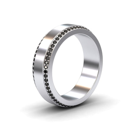 The Black Diamond 6mm Eternity Wedding Ring - Caleb is a silver ring with a single row of small black stones encircling its edge, displayed on a white background.