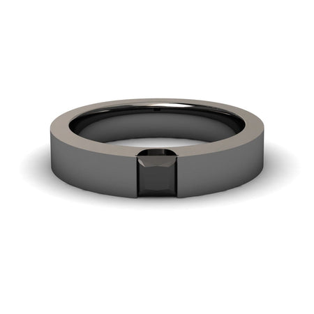 The Black Diamond Solitaire Mens Band - Xiuling features a sleek, modern design with a flat, polished black band and a square black gemstone set flush at the center.