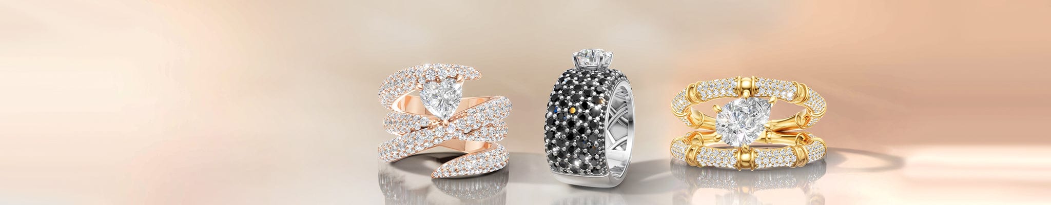 Three rings in different designs on a gradient background