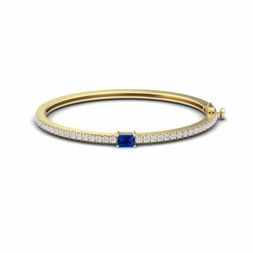 0.65-carat blue sapphire and diamond bangle bracelet in 14K yellow gold, Amandine style, front view