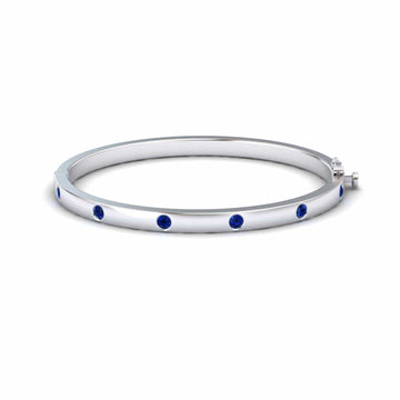 1.2-carat blue sapphire bezel set bracelet in 14K white gold, flavia style, front view