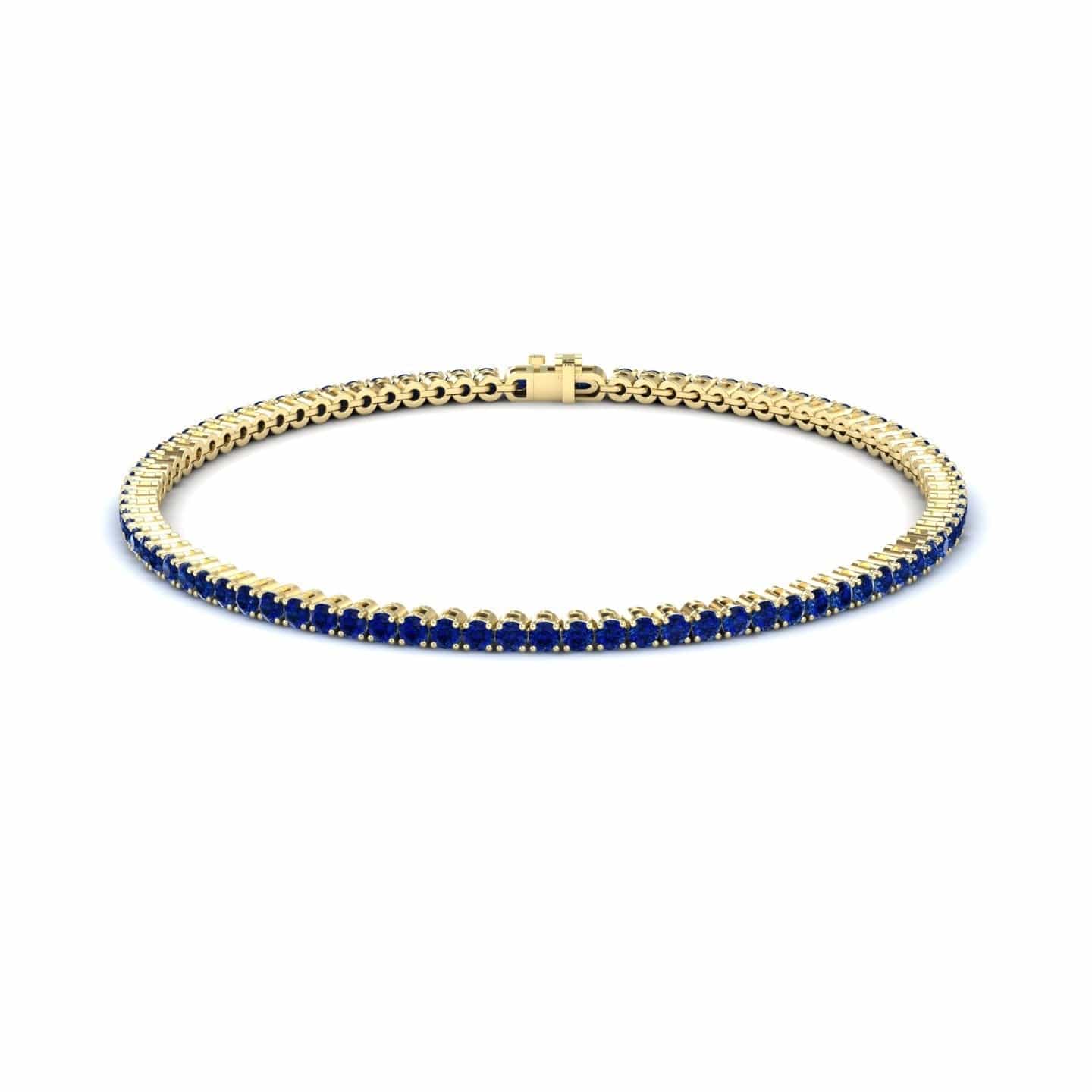 3.4-carat blue sapphire eternity bangle bracelet in 18K yellow gold, alejandra style, front view