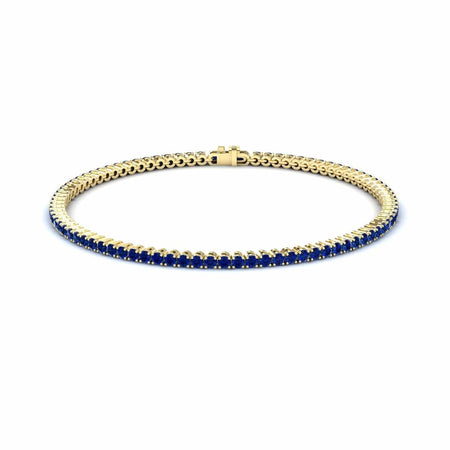 3.4-carat blue sapphire eternity bangle bracelet in 18K yellow gold, alejandra style, front view