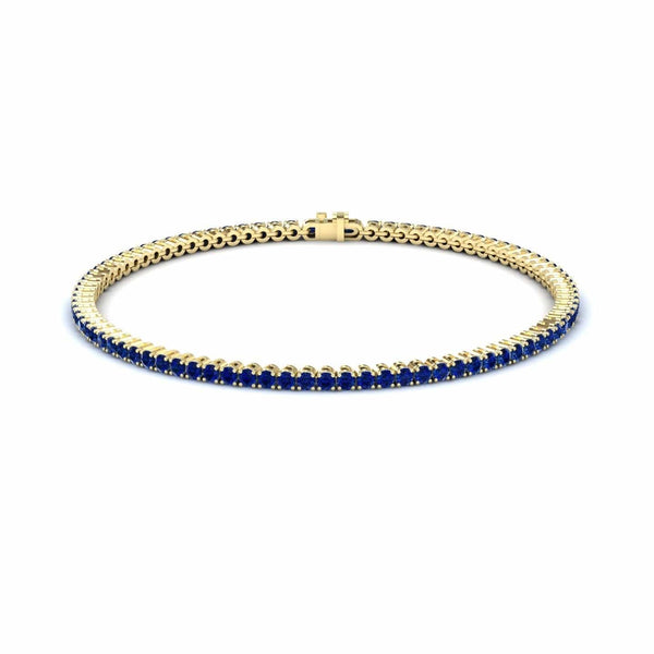 3.4-carat blue sapphire eternity bangle bracelet in 18K yellow gold, alejandra style, front view