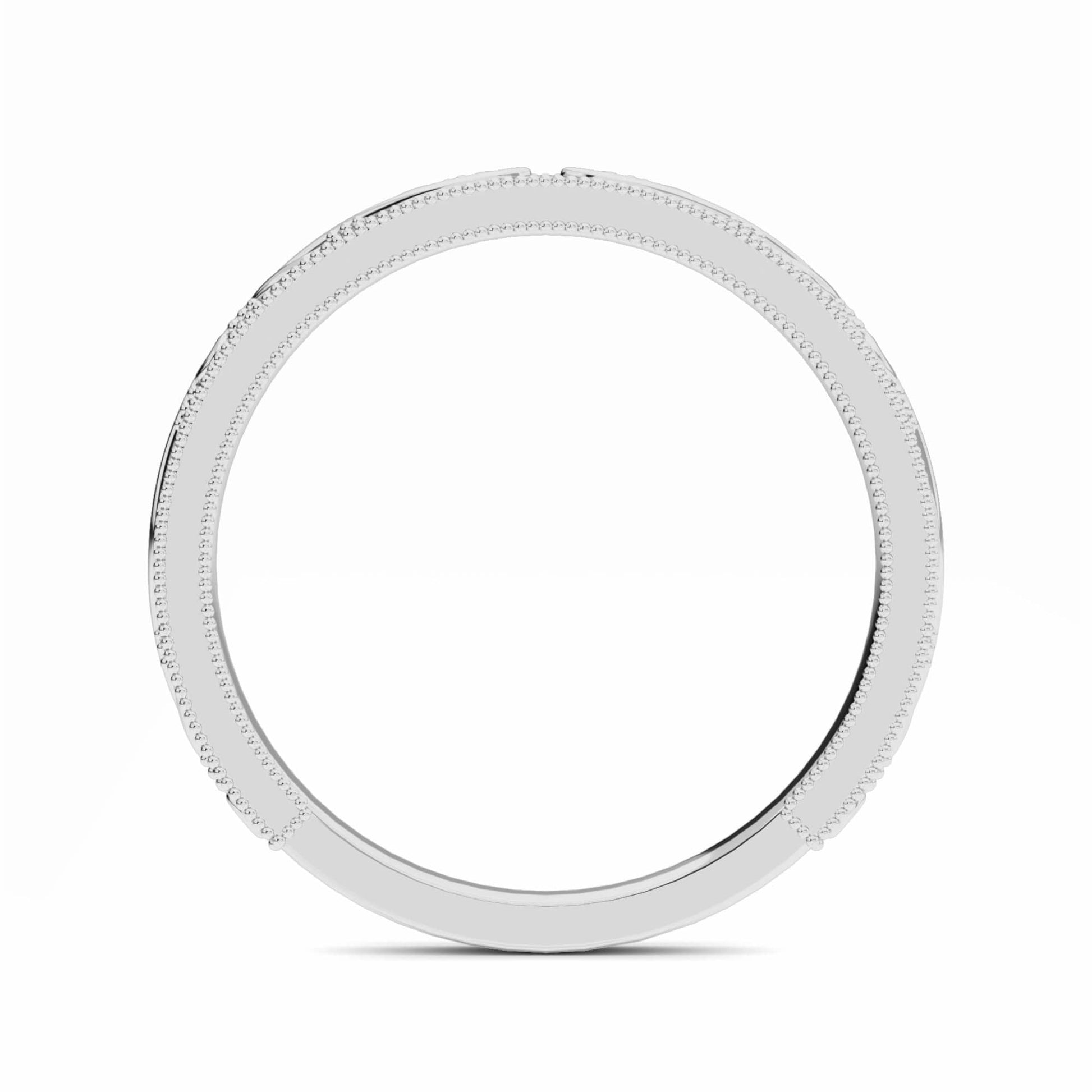 Gold ring with beaded design on a white background