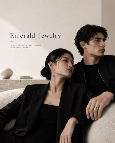 Young couple seating on couch wearing Emerald Jewelry