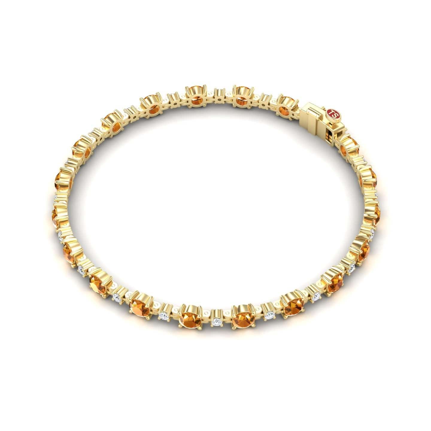 The Citrine & Diamond Tennis Bracelet - Natalia features alternating round yellow citrine gemstones and small diamonds in a delicate, repeating pattern, displayed against a white background.