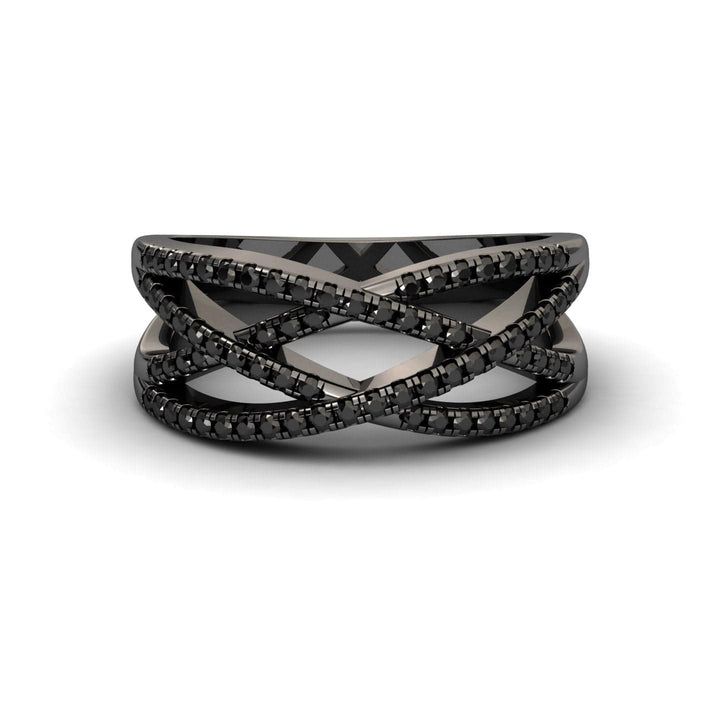 The Black Diamond Criss-Cross Pave Band Ring - Eden features multiple thin black bands set with sparkling black stones in a bold, modern design. Shown on a white background, it’s an elegant statement piece.
