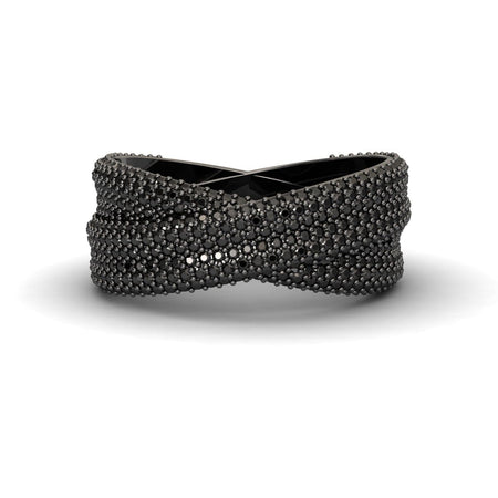 The Black Diamond Pave Crossover Statement Ring - Noor features a crisscrossed black design with textured, raised bead details for a modern, intricate look.