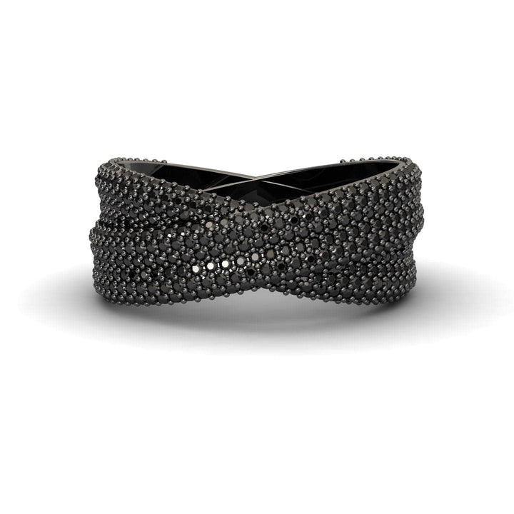 The Black Diamond Pave Crossover Statement Ring - Noor features a crisscrossed black design with textured, raised bead details for a modern, intricate look.