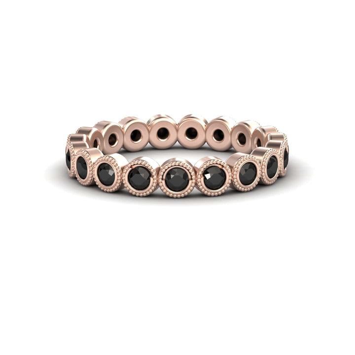 The Black Diamond Milgrain Bezel Set Eternity Band - Ira features a rose gold band with round black gemstones in bezel settings and milgrain detailing, shown on a white background.