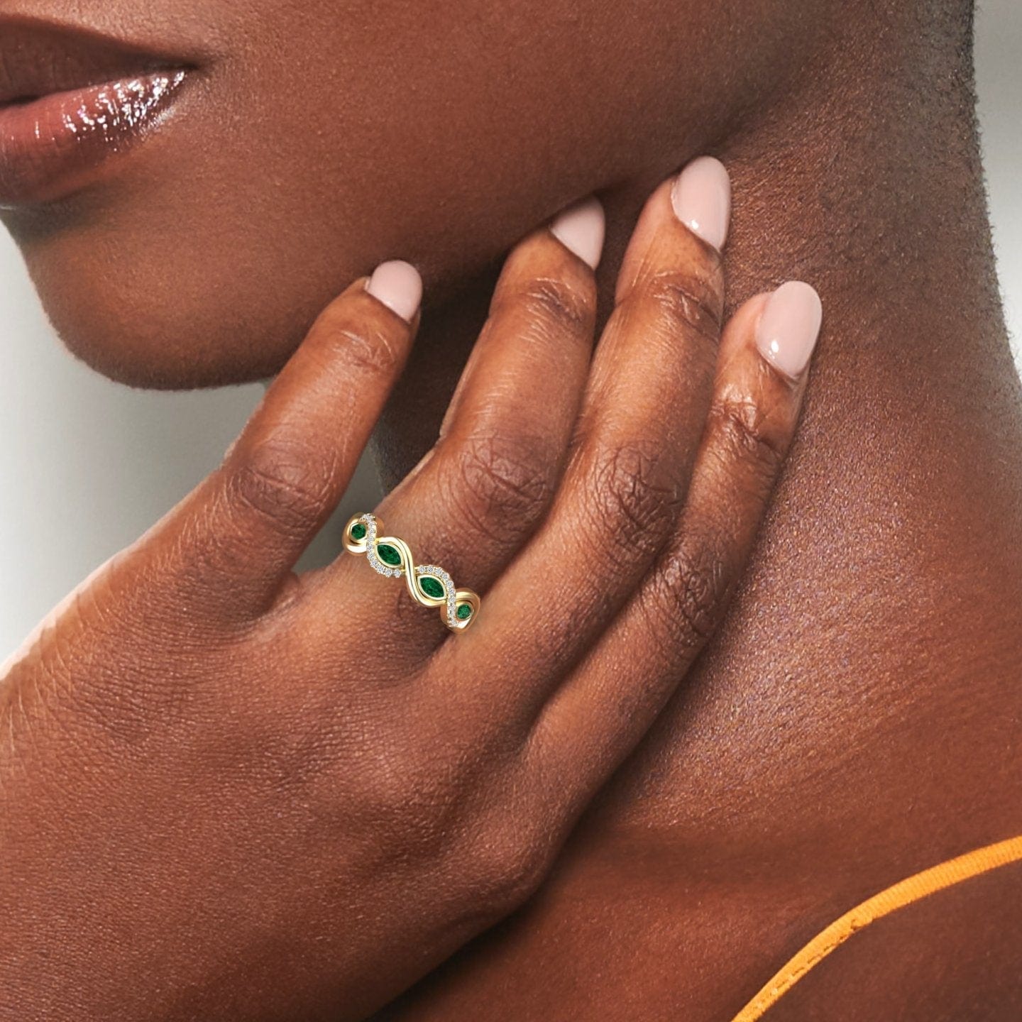 1.1 carat Emerald & Diamond Infinity Twist Band in 14K Yellow gold, Selma style, hand view